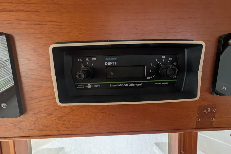Slide: The Image of Depth gauge on 1988 Grand Banks 46 Classic yacht dashboard. - 23
