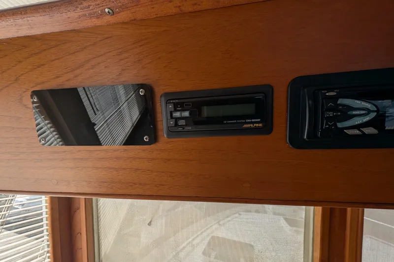 Slide: The Image of 1988 Grand Banks 46 Classic interior dashboard with Alpine audio system. - 25