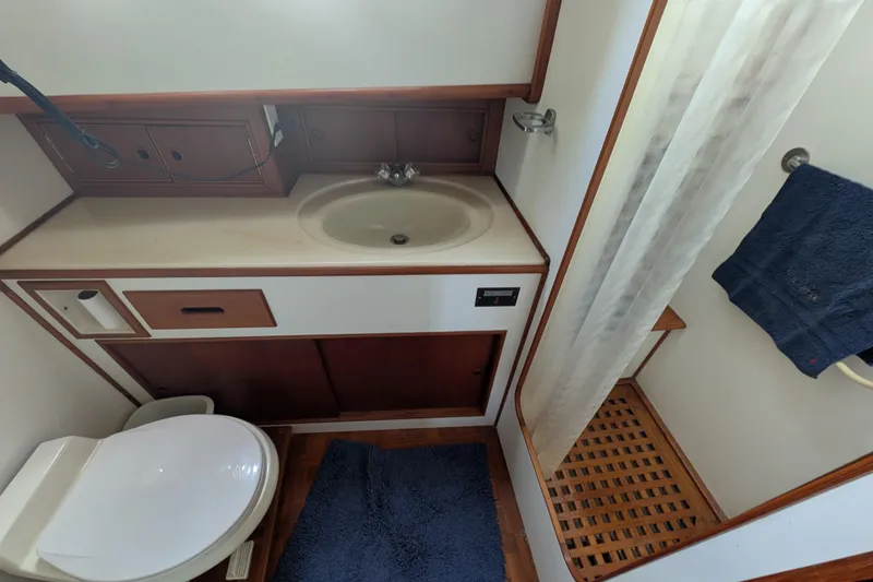 Slide: The Image of Bathroom interior of 1988 Grand Banks 46 Classic yacht with sink, toilet, and shower. - 29