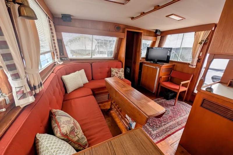 Slide: The Image of Interior of 1988 Grand Banks 46 Classic yacht with cozy seating and wooden decor. - 36