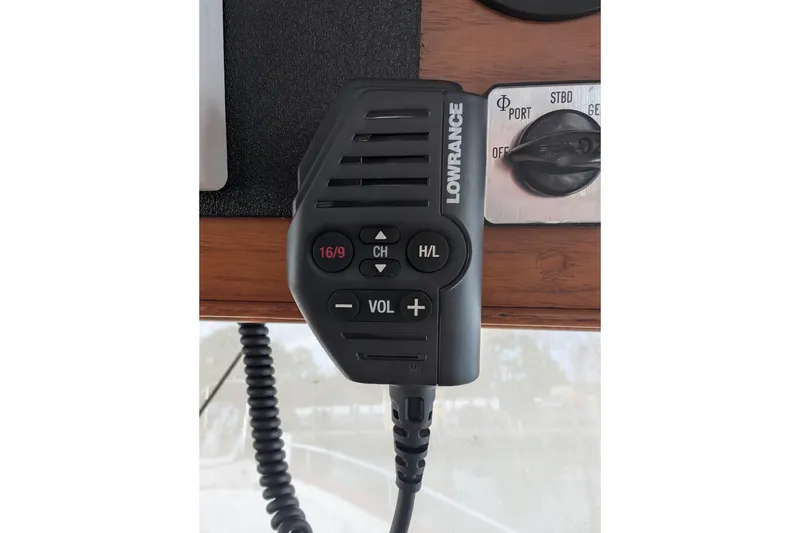 Slide: The Image of Lowrance marine radio on 1988 Grand Banks 46 Classic yacht dashboard. - 37