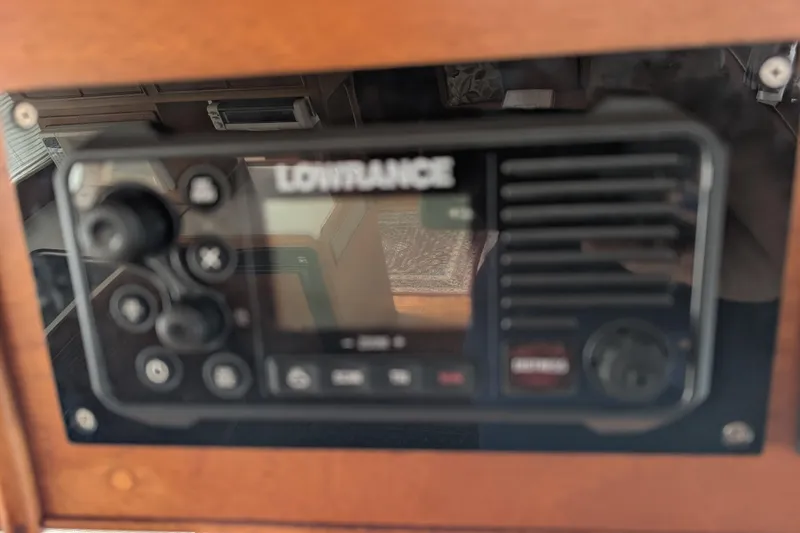 Slide: The Image of Lowrance marine radio on 1988 Grand Banks 46 Classic yacht dashboard. - 39