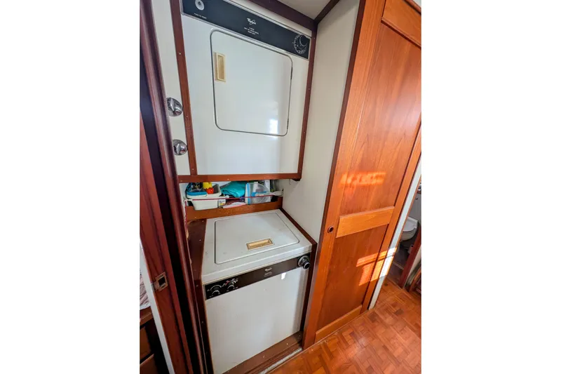 Slide: The Image of Laundry area in 1988 Grand Banks 46 Classic yacht with washer and dryer. - 47