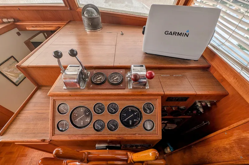Slide: The Image of Helm of 1988 Grand Banks 46 Classic with Garmin navigation system and vintage controls. - 6