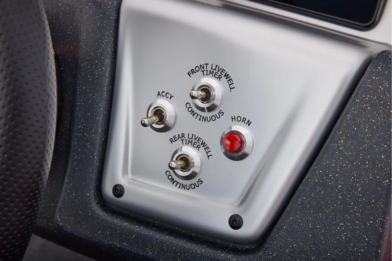 Slide: The Image of Manufacturer Provided Image: Control panel of 2026 Tracker Pro Team 175 Crappie Edition boat with switches and horn button. - 34