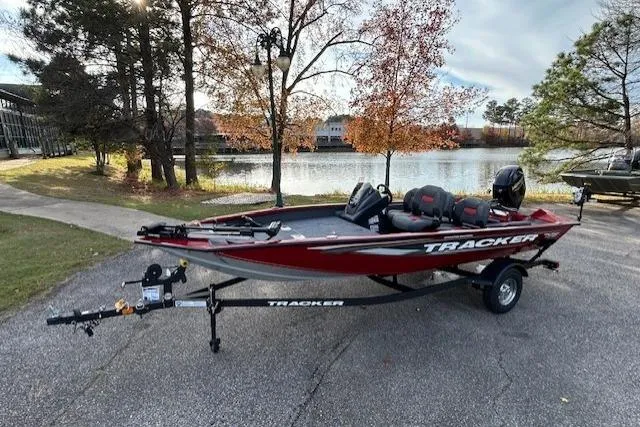 Slide: The Image of 2026 Tracker Pro Team 175 Crappie Edition boat by a scenic lake. - 48