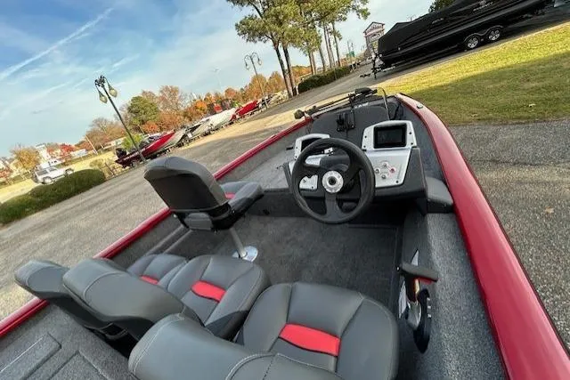 Slide: The Image of 2026 Tracker Pro Team 175 Crappie Edition boat with modern seating and steering console. - 56