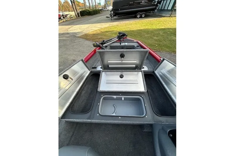 Slide: The Image of 2026 Tracker Pro Team 175 Crappie Edition boat with open storage compartments. - 58