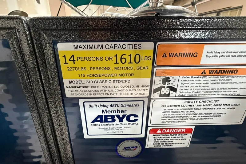 Slide: The Image of 2021 Crest Classic Platinum 240 SLC capacity label: 14 persons, 1610 lbs, 115 HP motor. - 16