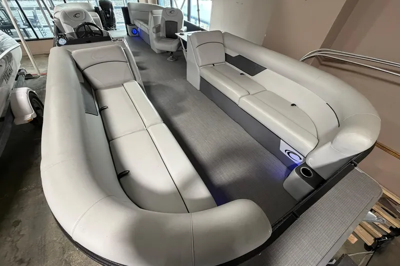 Slide: The Image of 2021 Crest Classic Platinum 240 SLC pontoon boat interior with luxurious seating and modern design. - 3