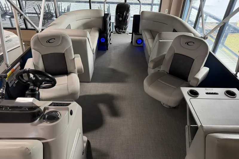 Slide: The Image of Interior of 2021 Crest Classic Platinum 240 SLC pontoon boat with plush seating and modern design. - 4