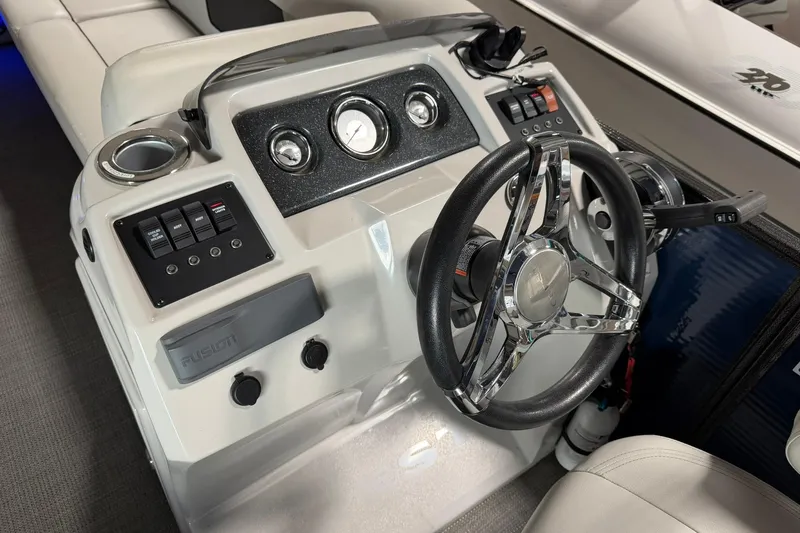 Slide: The Image of Steering console of 2021 Crest Classic Platinum 240 SLC boat with modern controls. - 5