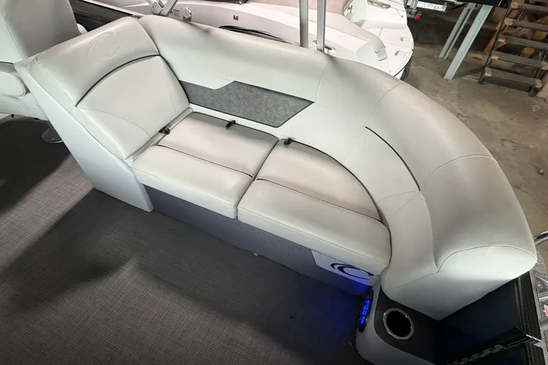 Slide: The Image of 2021 Crest Classic Platinum 240 SLC boat interior with plush seating and modern design. - 9