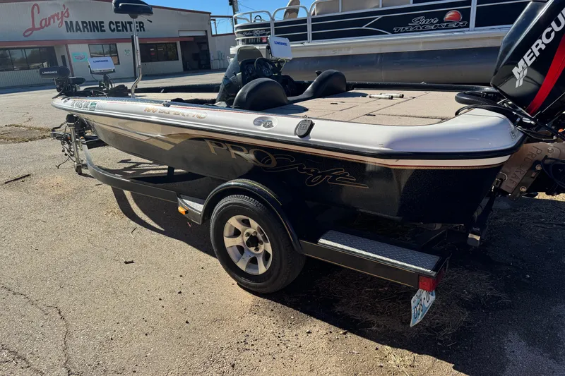 Slide: The Image of 2003 ProCraft 190 Super Pro SC/DC boat at Larry's Marine Center, featuring a Mercury engine. - 3