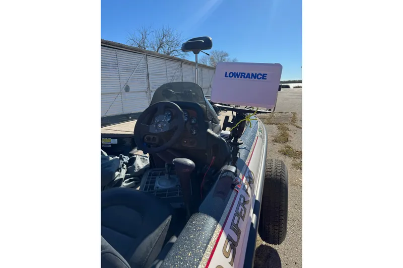 Slide: The Image of 2003 ProCraft 190 Super Pro SC/DC boat with Lowrance electronics, steering wheel, and dashboard. - 6