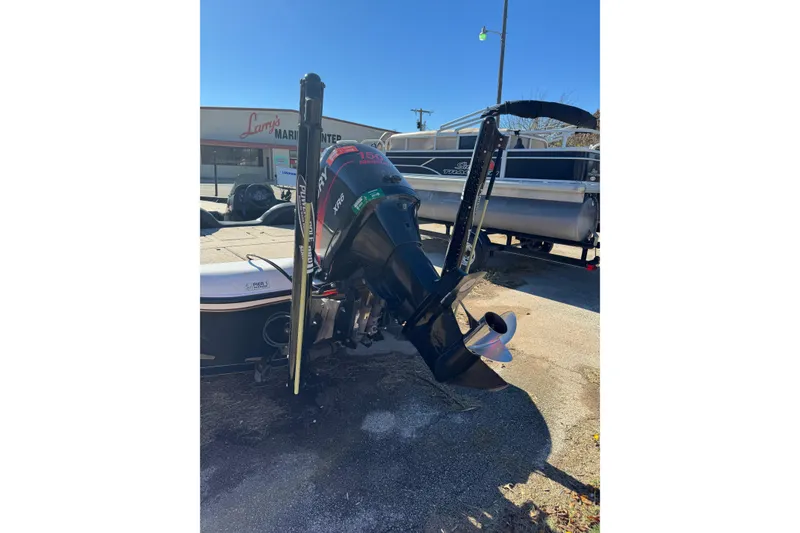 Slide: The Image of 2003 ProCraft 190 Super Pro SC/DC boat with powerful outboard motor at marina. - 7