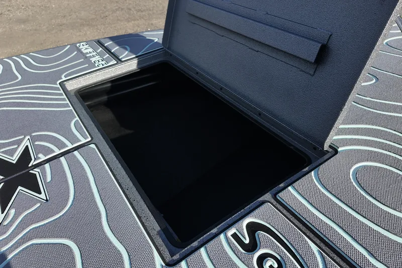 Slide: The Image of 2026 Xpress Skiff 185 boat interior with seating and steering console. - 10