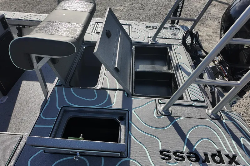 Slide: The Image of 2026 Xpress boat dashboard with steering wheel, controls, and navigation system. - 14