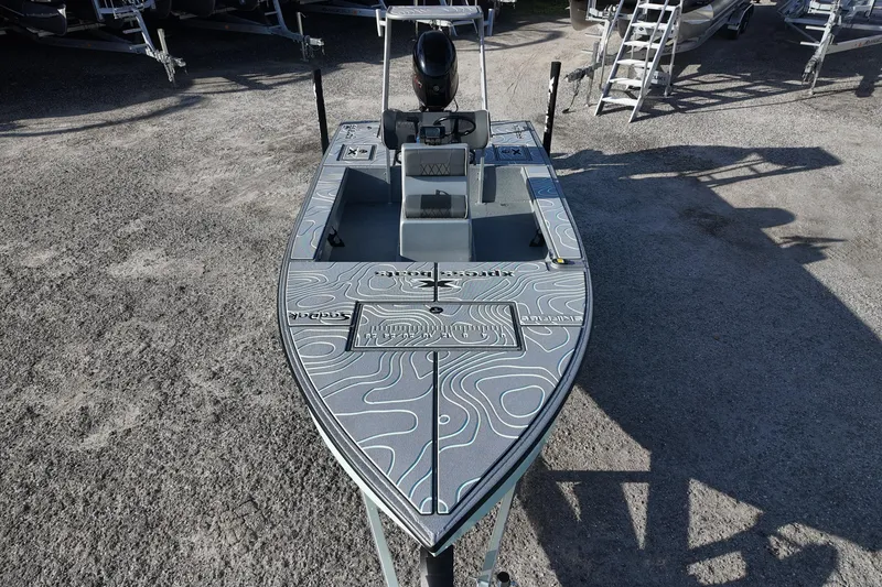 Slide: The Image of 2026 Xpress boat interior with modern seating and steering console design. - 15