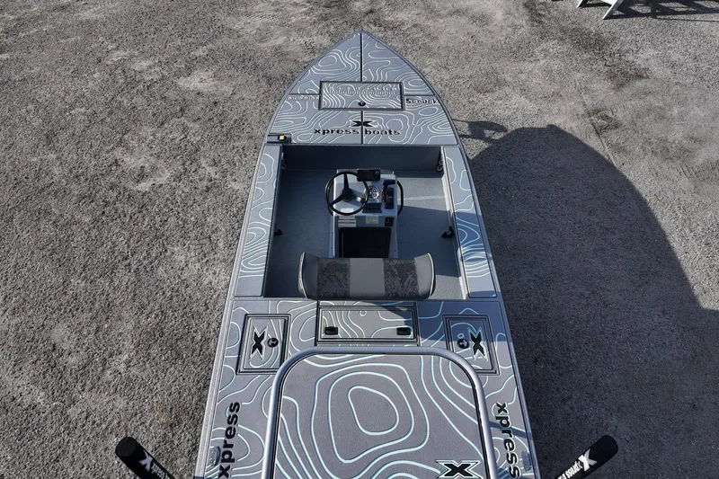 Slide: The Image of 2026 Xpress boat deck with storage compartments and seating, featuring modern design. - 17