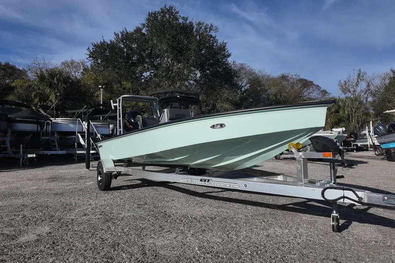 Slide: The Image of 2026 Xpress Skiff 185 boat with modern design and intricate patterns on deck. - 4