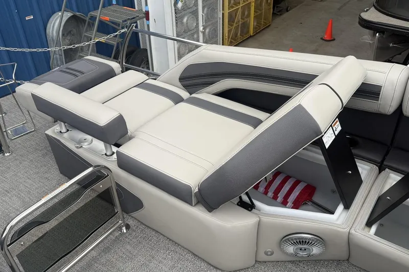 Slide: The Image of 2025 Barletta CORSA 25M boat interior with adjustable seating and storage compartment. - 18