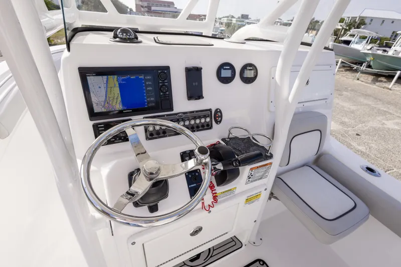 Slide: The Image of 2020 Sea Fox 249 Avenger boat dashboard with navigation system and controls. - 15