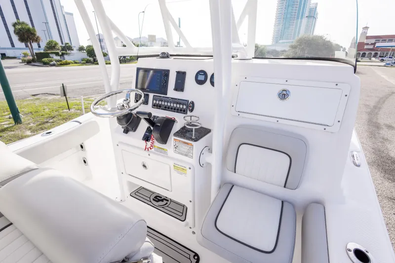 Slide: The Image of 2020 Sea Fox 249 Avenger boat interior with steering console and seating. - 23