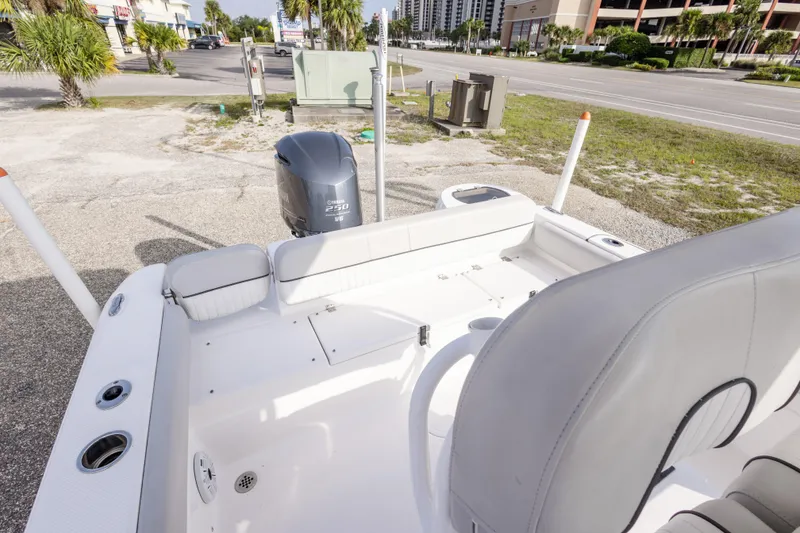 Slide: The Image of 2020 Sea Fox 249 Avenger boat interior with Yamaha 250 engine, parked outdoors. - 24