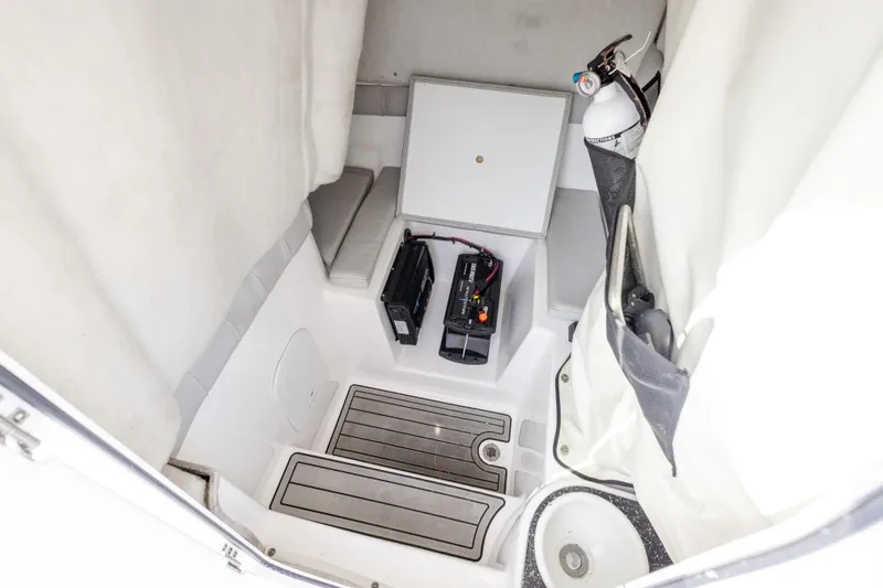 Slide: The Image of 2020 Sea Fox 249 Avenger interior cabin with batteries and fire extinguisher. - 25