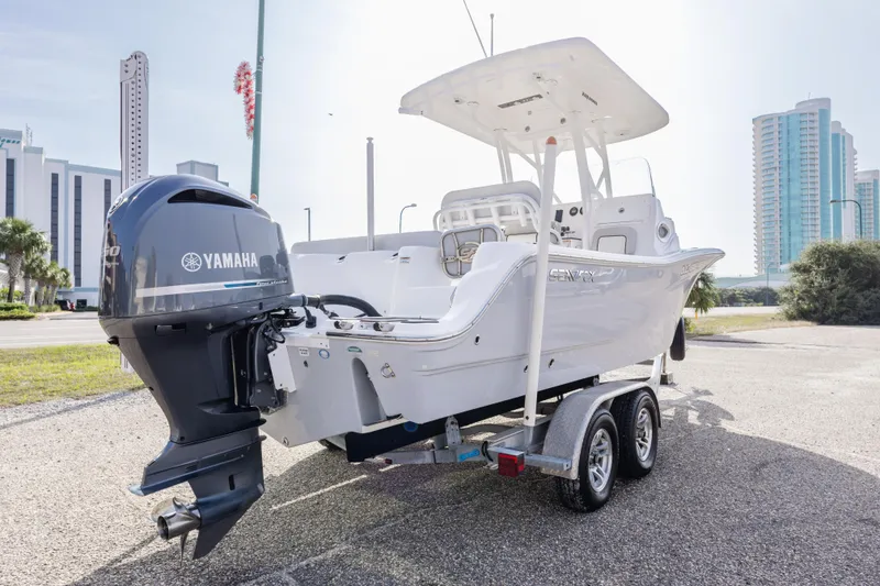 Slide: The Image of 2020 Sea Fox 249 Avenger boat with Yamaha engine on trailer, urban background. - 27