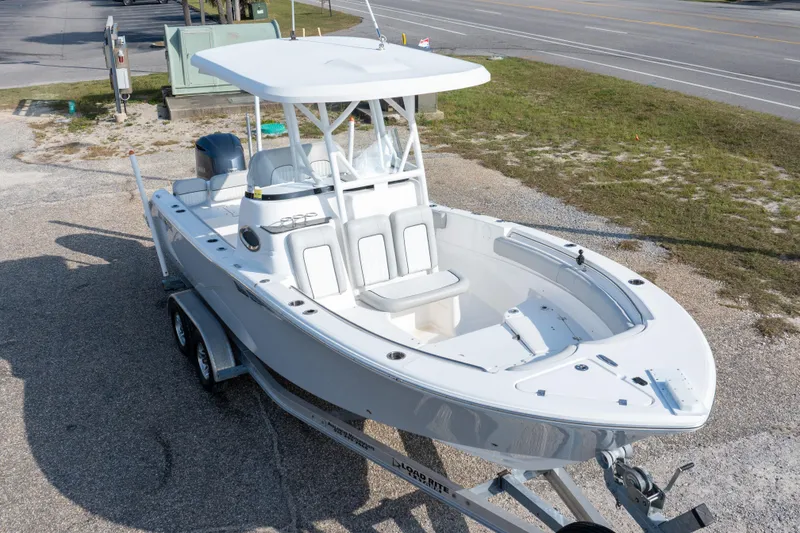 Slide: The Image of 2020 Sea Fox 249 Avenger boat on trailer, parked near a road. - 3