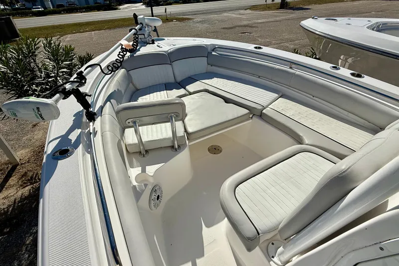 Slide: The Image of 2020 Sea Fox 249 Avenger boat interior with white seating and trolling motor. - 31