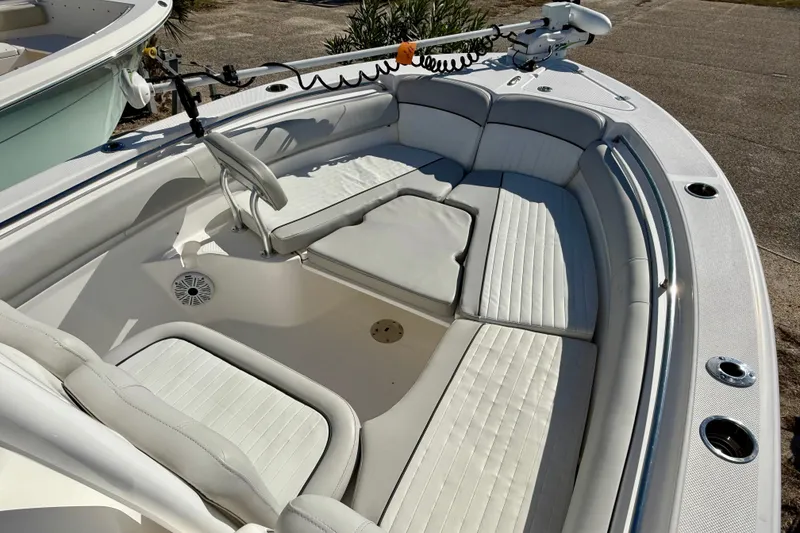 Slide: The Image of 2020 Sea Fox 249 Avenger boat interior with cushioned seating and fishing rod holders. - 33