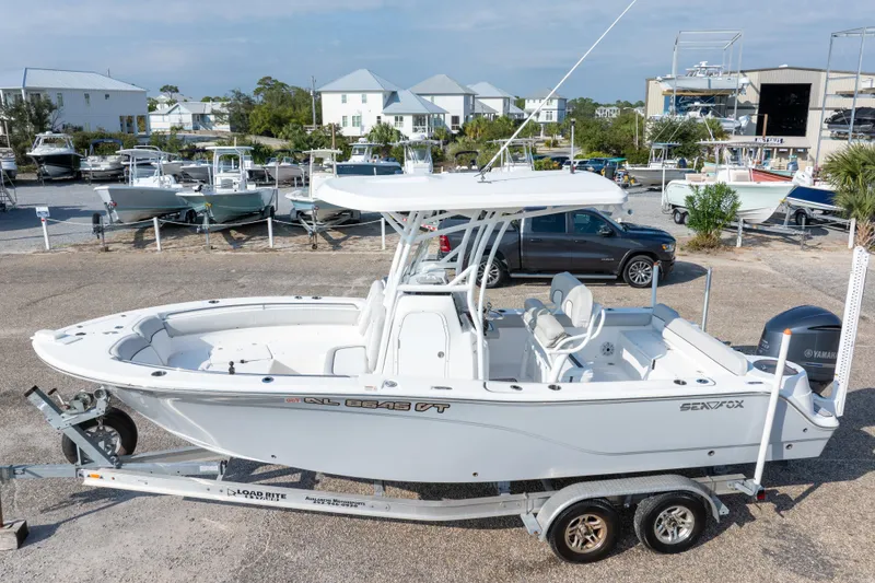 Slide: The Image of 2020 Sea Fox 249 Avenger boat on trailer in marina setting. - 4