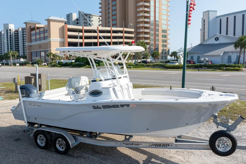 Slide: The Image of 2020 Sea Fox 249 Avenger boat on trailer, urban background with buildings. - 5