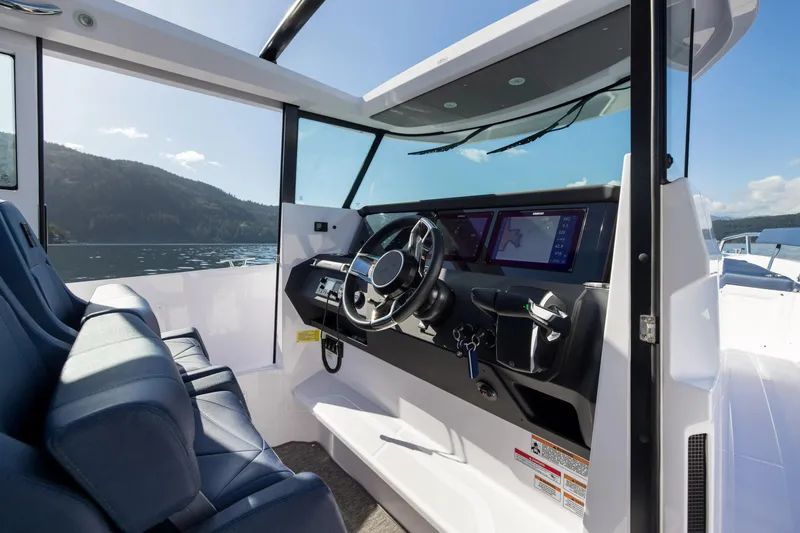 Slide: The Image of Interior view of 2026 Axopar 29 XC Aft Sofa Twin 200 Brabus Sandstone boat cockpit. - 5