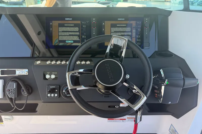 Slide: The Image of Steering wheel and dashboard of 2026 Axopar 29 XC Cross Cabin boat. - 22