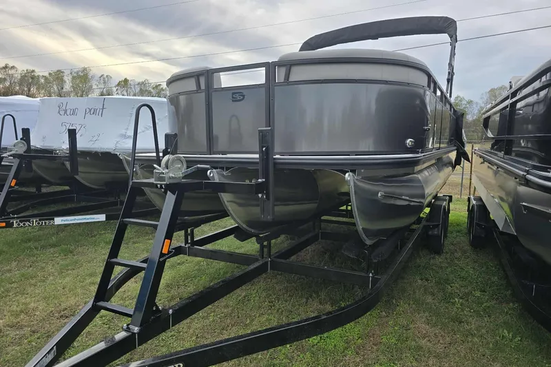 The Image of 2026 Dockside pontoon boat on trailer, displayed outdoors. - 1