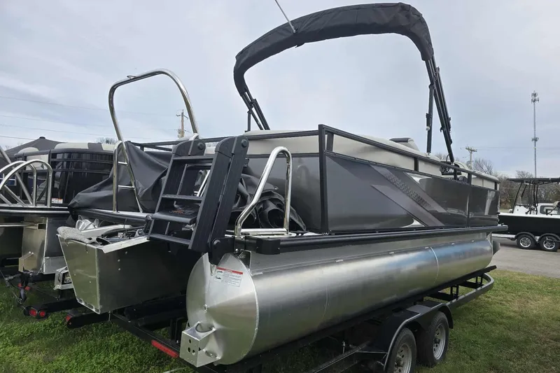 Slide: The Image of 2026 Dockside pontoon boat on trailer, featuring sleek design and modern amenities. - 4