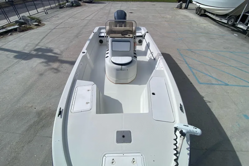 Slide: The Image of Rear view of a 2000 Sprint 221 boat with an outboard motor. - 11