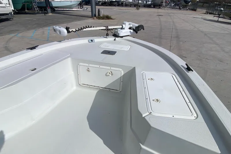 Slide: The Image of 2000 Sprint 221 boat interior with storage compartments and trolling motor. - 9