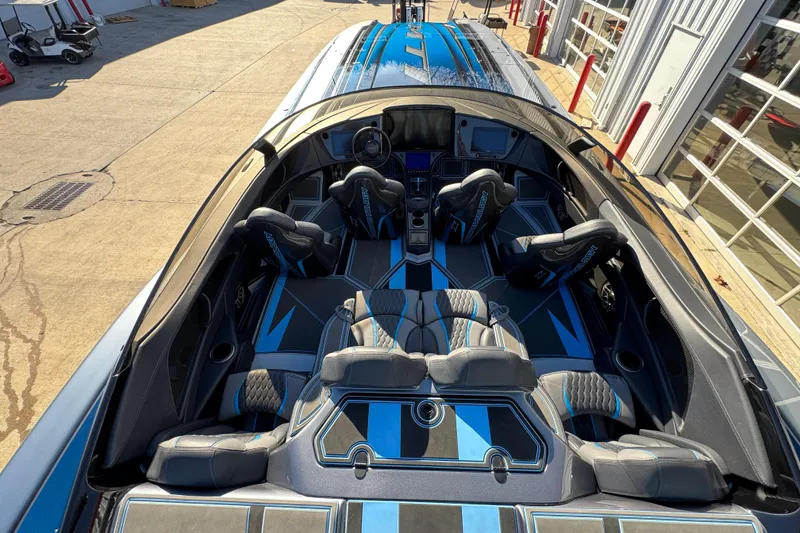 Slide: The Image of Interior of 2025 MTI 440X boat with sleek seating and modern design. - 13