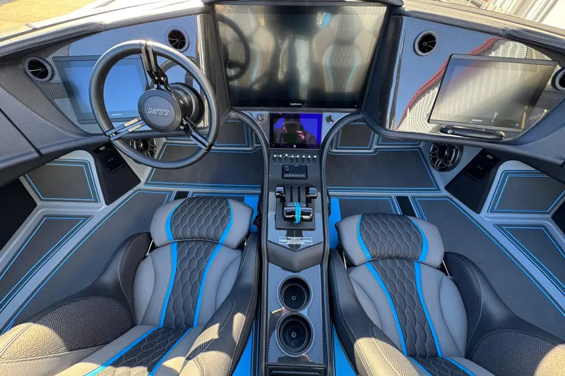 Slide: The Image of Luxurious MTI 440X 2025 boat interior with advanced controls and sleek design. - 14