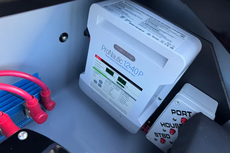 Slide: The Image of Battery charger setup in MTI 440X, 2025 model, featuring ProNautic 12-40P and wiring components. - 17