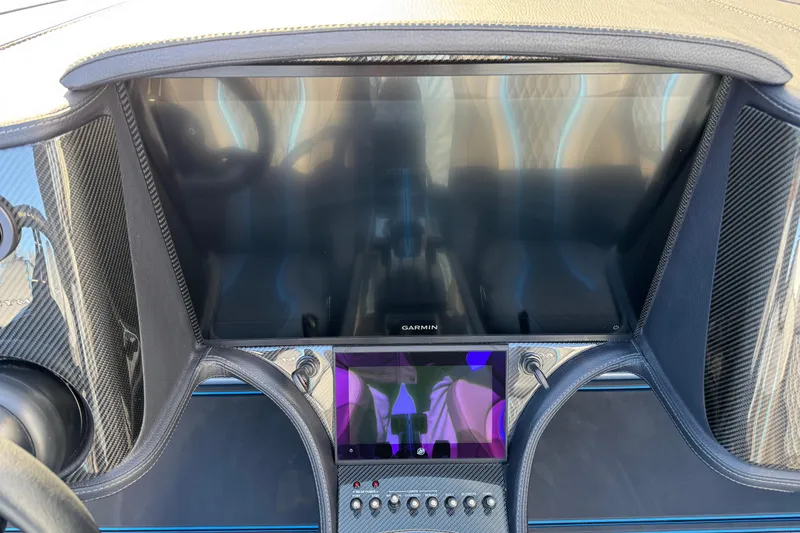 Slide: The Image of Dashboard of 2025 MTI 440X with Garmin display and carbon fiber accents. - 25