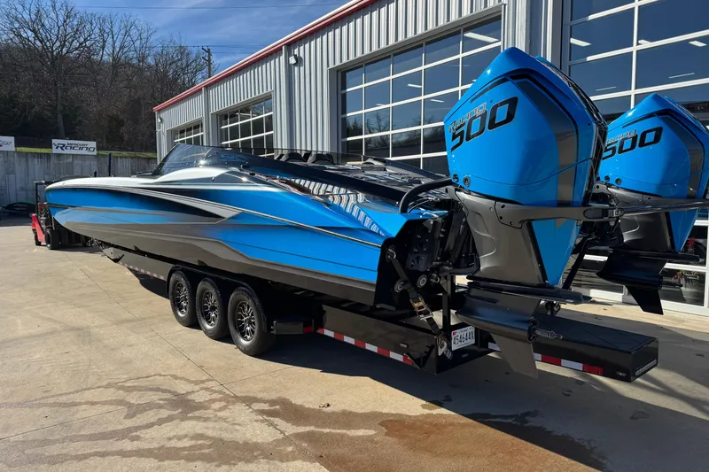 Slide: The Image of 2025 MTI 440X powerboat with twin Mercury 500 engines on a trailer. - 6