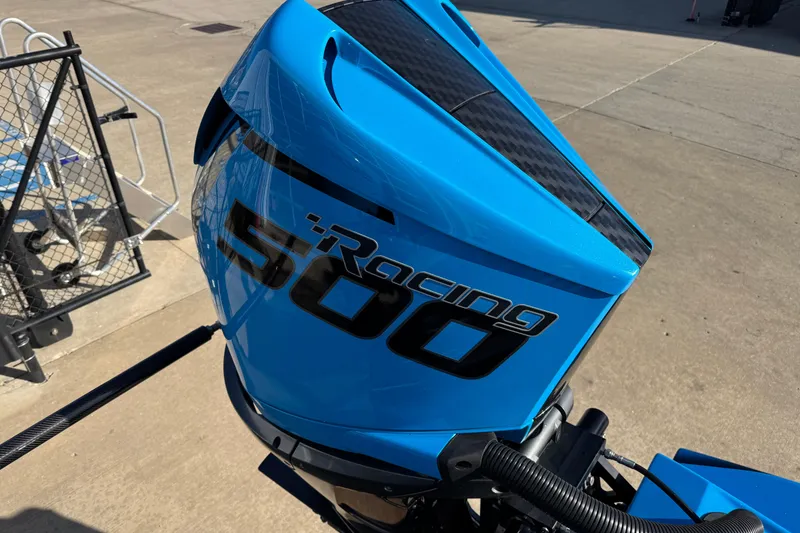 Slide: The Image of Blue MTI 440X 2025 outboard motor with "Racing 500" decal, on concrete surface. - 7