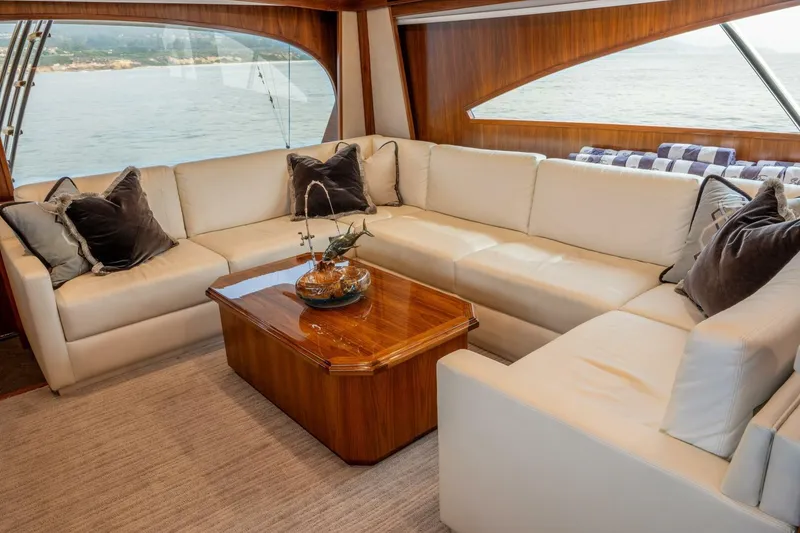 Slide: The Image of Luxurious interior of 2018 Viking 80 Enclosed Bridge yacht with elegant seating and ocean view. - 13