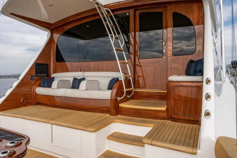 Slide: The Image of Luxurious 2018 Viking 80 Enclosed Bridge yacht with elegant wood finishes and comfortable seating. - 54
